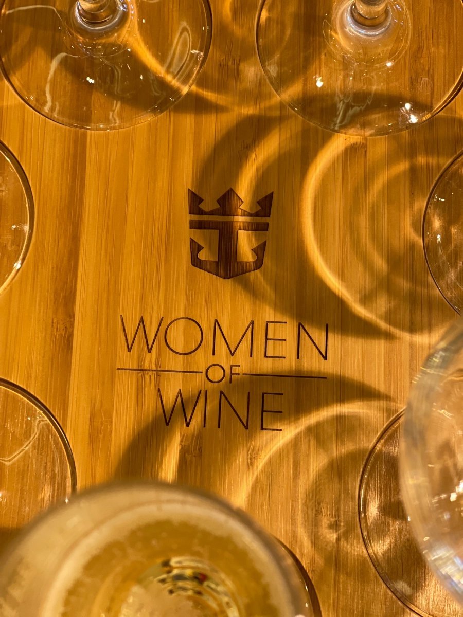 Women of Wine event with wine glasses on wooden table