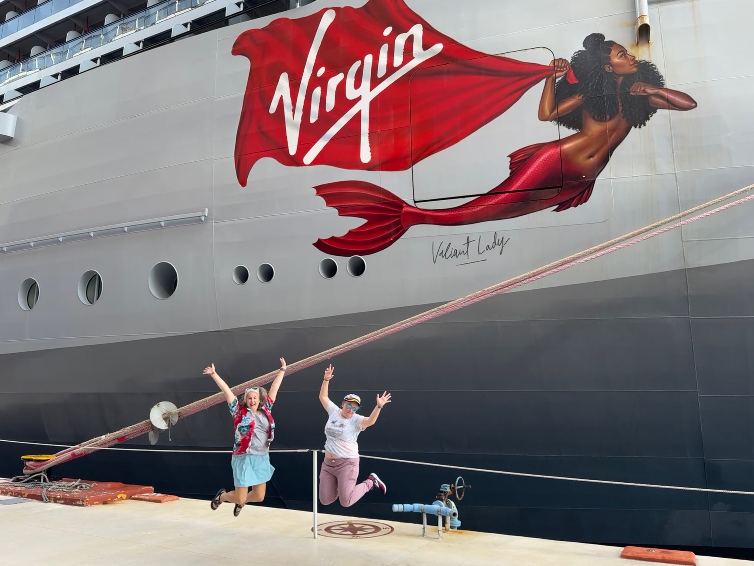 Virgin Cruises Valiant Lady ship with mermaid artwork and visitors
