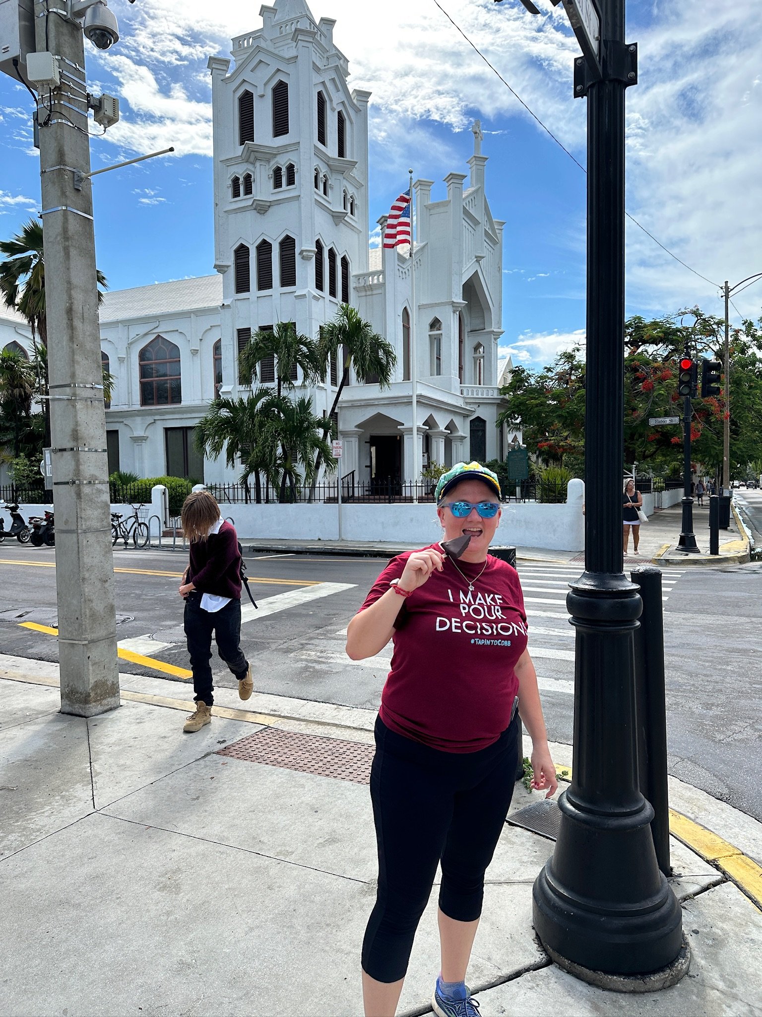 Woman jogging past white church in Key West Florida