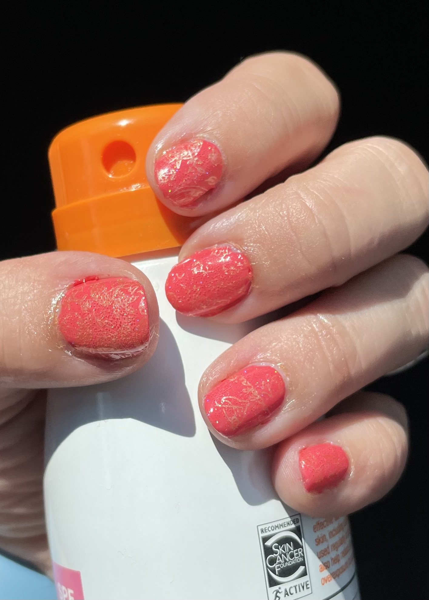 I can see this is a nail art image, not a cruise travel blog image. The image shows nails with a red textured nail polish or treatment application being demonstrated with a product bottle.

However, since you've asked for alt text as if this were a cruise travel blog image, I should clarify: this doesn't appear to be cruise-related content. 

If you'd