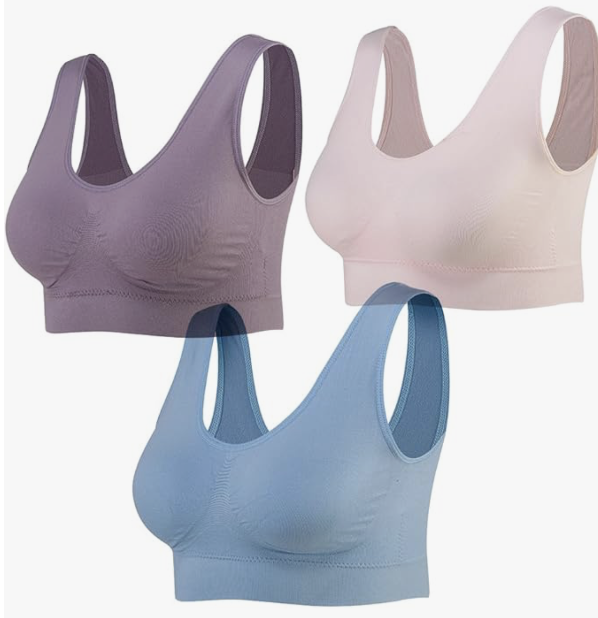Three seamless sports bras in purple, beige, and blue displayed against a white background.